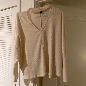 White sweater cut out on neck